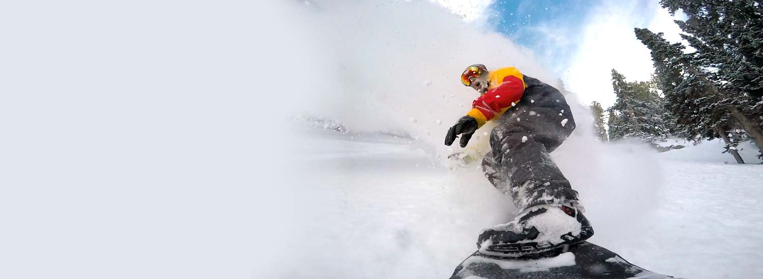 Jeremy Jensen surfing the snow without any bindings on his Grassroots Powsurfer.