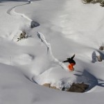 Jeremy Jensen Ollies his Grassroots Powsurfer in the Utah Backcountry.