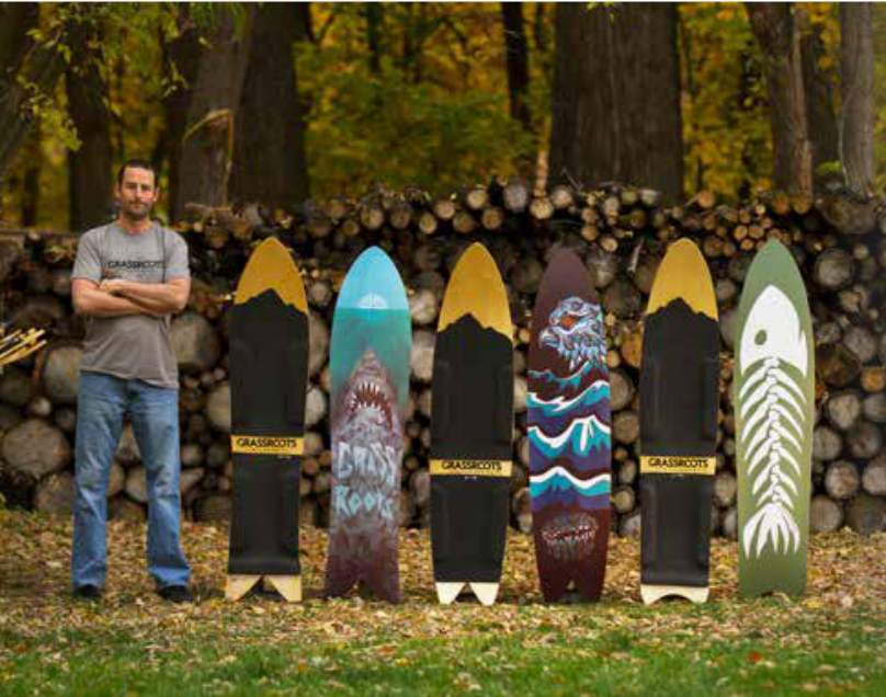 Jeremy Jensen stands with his creations. Jeremy is the founder of Grassroots Powdersurfing and the leading pioneer in the binding-free powsurfing and snowsurfing movement.